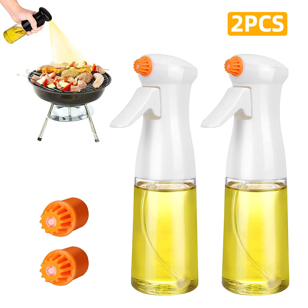 Two oil sprayers with orange nozzles and a person using one to cook on a grill.