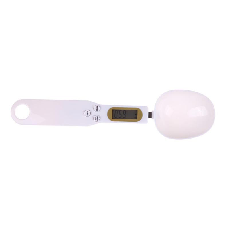 Digital scale with a white ball on a white background