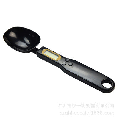 Digital measuring spoon on a white background